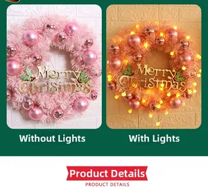 Pink Christmas wreath 30cm with ornaments and LED light comparison on white wall