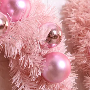Pink 30cm Christmas ball wreath featuring mixed texture ornaments and frosted pine needles