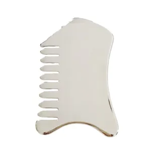 Close-up of heart-shaped stainless steel scraping tool with mirror finish and comb teeth