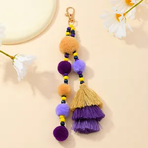 Portachiavi bohémien con pompon di peluche, perline e nappe colorate per borse a mano