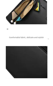 Detail of black leather handbag with lychee texture, floral scarf and pearl charm