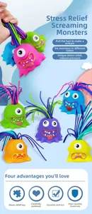 Detail view of colorful monster sensory toys showing hair-pulling scream sound feature