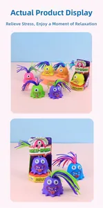 Detail of colorful monster stress toys with hair-pulling feature in retail boxes