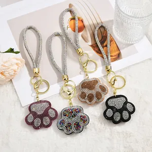 Sparkling rhinestone cat paw keychains in multiple colors with gold lobster clasps