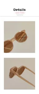 Detail view of round beige frames and brown lenses on stylish kids sunglasses