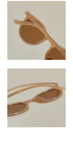 Macro view of translucent beige round frames with brown lenses for kids sunglasses