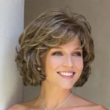 Close-up of a short curly synthetic wig with natural highlights and layered volume