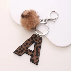 Western leopard print leather letter A keychain with brown faux fur pom pom and silver clip