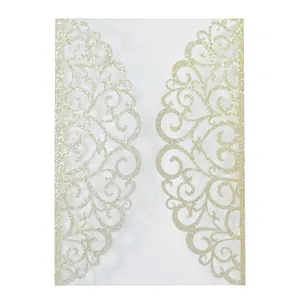 Detail of glitter laser cut engagement invitation with ornate European scroll pattern