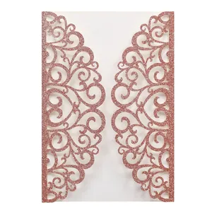 Macro detail of rose gold laser-cut floral pattern with glitter finish for wedding invitations