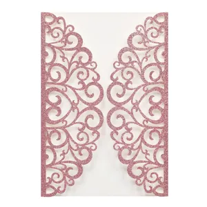 Close-up of laser-cut hollow rose pink glitter paper wedding invitation jacket cover