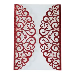 Macro detail of red glitter laser cut wedding invitation with lace heart pattern