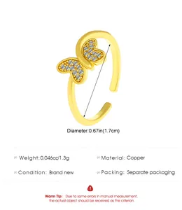 Detail view of gold butterfly open ring with dimensions 1.7cm and copper material specs