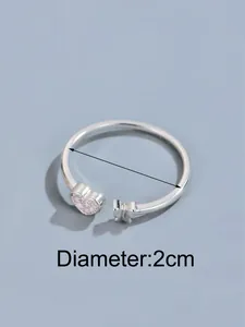 Detail of silver butterfly open ring with pink heart stone and 2cm inner diameter