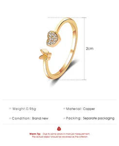 Detail view of adjustable gold butterfly ring with heart pattern, 0.96g copper material