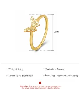Detailed view of golden butterfly ring made of copper with fine hollow wing textures