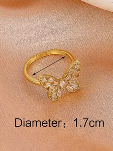 Close-up of golden butterfly ring with marquise zircon stones and 1.7cm diameter mark
