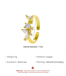 Detail view of gold floral copper ring with marquise zircon stones and 1.7cm diameter size