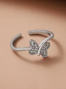 Macro shot of silver butterfly ring featuring micro-set cubic zirconia on wings