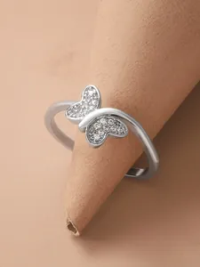 Detailed close-up of a silver butterfly open ring with sparkling pavé micro-zircons