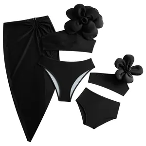 Three-piece black mother-daughter bikini set with large 3D flower detail and slit skirt