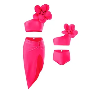 Three-piece rose red bikini set with 3D floral one-shoulder top and high slit beach skirt