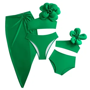 Emerald green bikini set with 3D floral accent and matching girls swimwear set