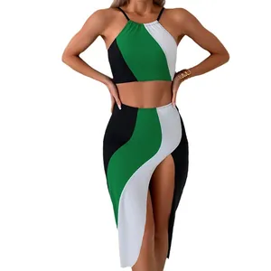 Three-piece women swimsuit set featuring green, white, and black colorblock halter top and skirt