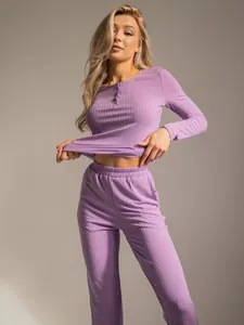 Detail of purple ribbed knit fabric on long-sleeve pajama set with button neckline