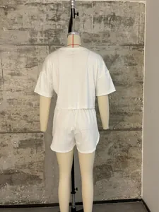 Back view of women's white ribbed knit loungewear set featuring loose top and shorts