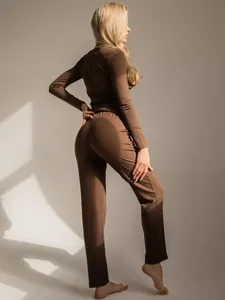 Detailed texture of dark brown ribbed long sleeve lounge set with vertical knitting pattern