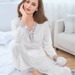 Women's white velvet pajama set with long sleeves, pants and elegant lace trim