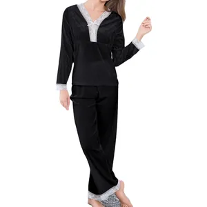 Women black velvet pajama set with long sleeves, v-neckline and white lace trim detail