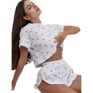 Women's white cotton cherry print pajama set with cropped short sleeve top and curved shorts
