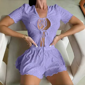Detail of light purple crochet lace pajama set with tie-front top and scalloped shorts