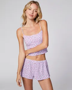 Detailed view of women's lavender cherry print pajamas with lace trim and bow accent