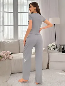 Detail of grey ribbed loungewear set showing soft fabric texture and relaxed drape on model