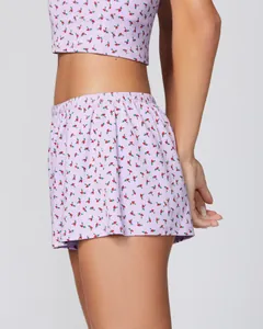 Detail of light purple floral pajama set with cherry print and delicate lace trim