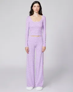 Detail of lavender two-piece floral loungewear featuring U-neck top and wide-leg pants
