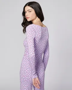 Detail view of lavender floral pajamas set with cherry pattern and slim fit knit fabric