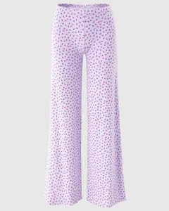 Detail of light purple floral pajama pants with elastic waist and a small bow tie