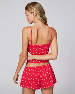 Rear view of red floral lace camisole and shorts set with festive snowflake print