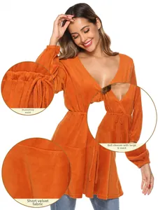 Detail of orange v-neck knit dress featuring lantern sleeves and drawstring waist