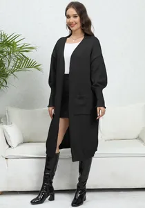 Elegant long black knit cardigan with lantern sleeves and pockets for a casual look.