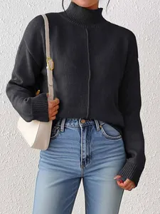 Detail of black rib-knit turtleneck sweater featuring decorative central vertical seam