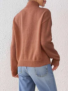 Close-up of the back and side view of brown knit sweater with ribbed cuffs and hem