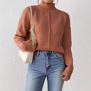 Women casual mock neck brick red knit sweater paired with high waist jeans and white bag