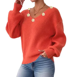 Pull en maille orange à col en V avec marguerites 3D blanches et manches bouffantes