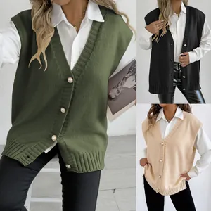 Detail of V-neck knit vest with pearl buttons in olive green, black and beige colors