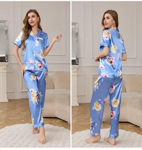 Blue satin floral pajama set with short sleeve button-down top and matching trousers